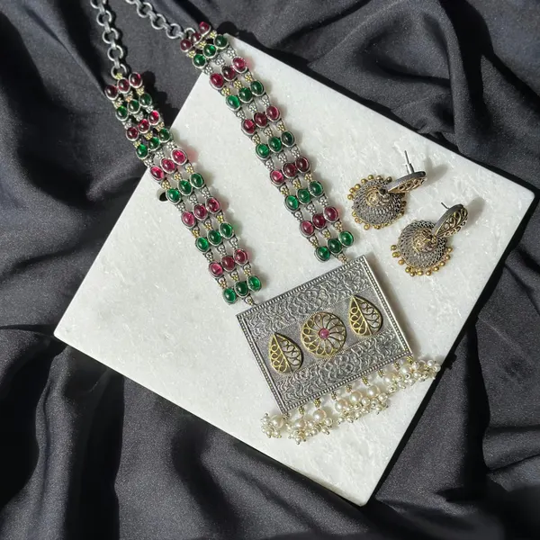 Long oxidised necklace with green and red beads and matching earrings